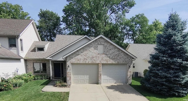 view of front of house with a front lawn and central air condition unit