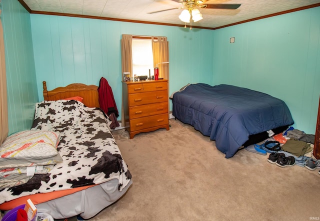 bedroom featuring ceiling fan, light colored carpet, and crown molding