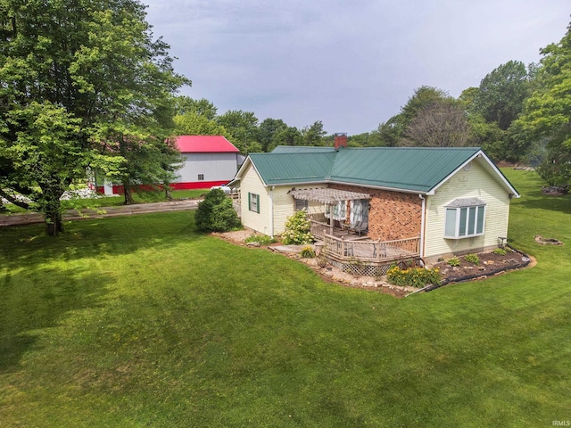 exterior space with a lawn and a deck