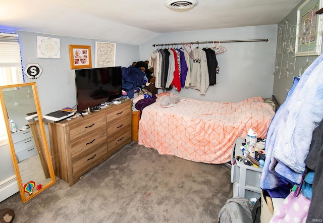 carpeted bedroom with vaulted ceiling