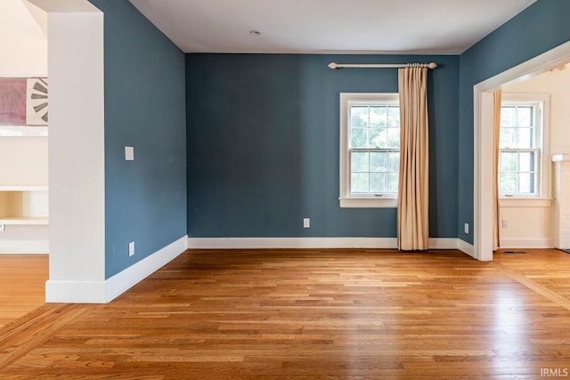 empty room featuring wood-type flooring