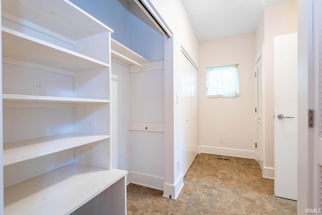 closet with light tile floors