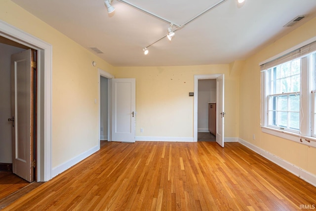 interior space featuring light hardwood / wood-style floors and track lighting