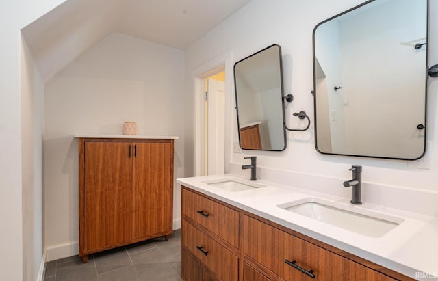 bathroom featuring double vanity and tile flooring