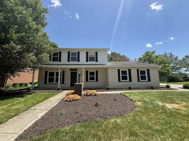 front facade with a front lawn