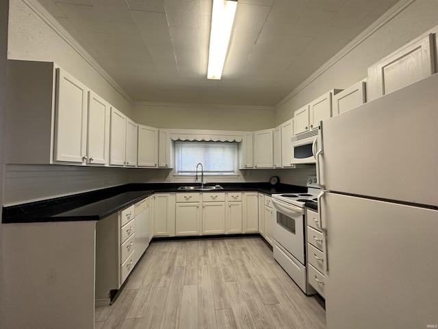 kitchen with sink, white cabinets, white appliances, and ornamental molding