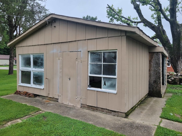 view of property exterior featuring a lawn