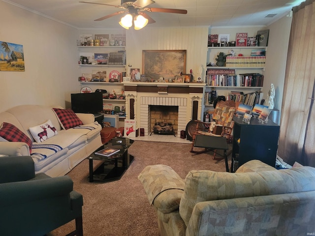 carpeted living room with ceiling fan, ornamental molding, and a brick fireplace