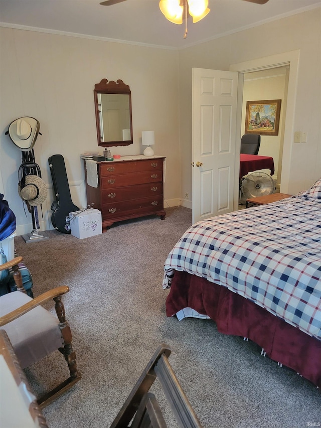 bedroom with carpet, ceiling fan, and ornamental molding