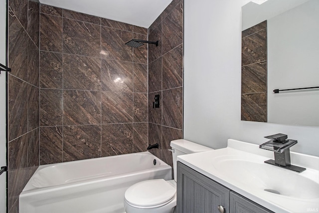 full bathroom with tiled shower / bath combo, vanity, and toilet