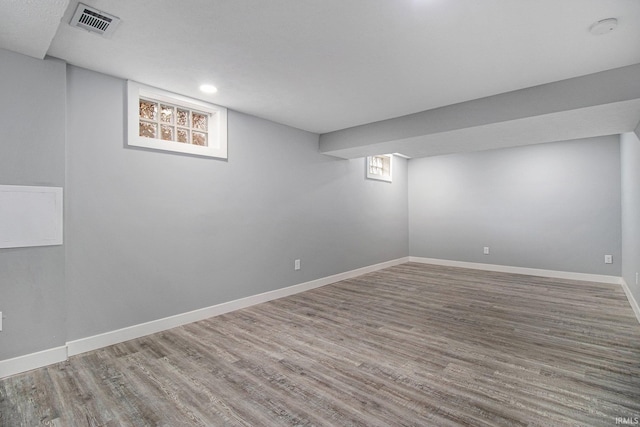 basement featuring hardwood / wood-style floors