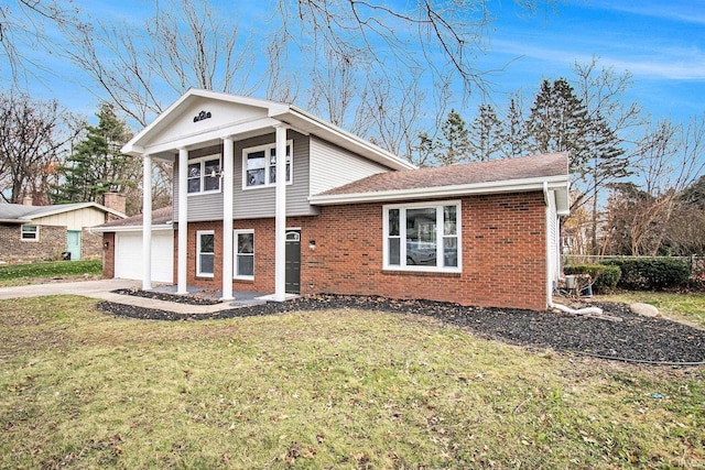 view of front of home with a garage and a front lawn