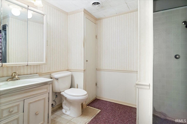 bathroom with vanity, toilet, and crown molding