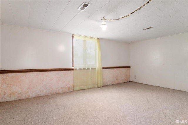 unfurnished room featuring carpet