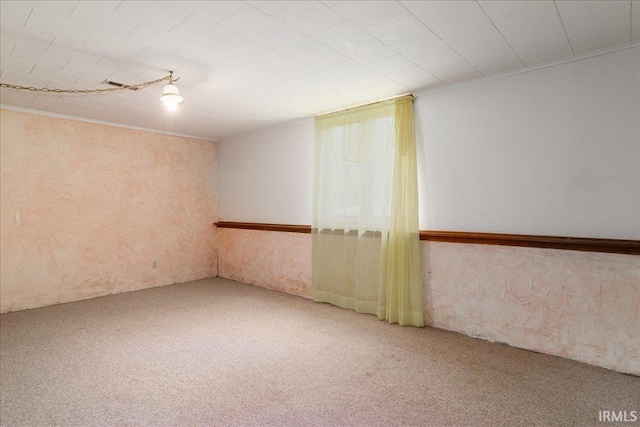 carpeted spare room with ornamental molding