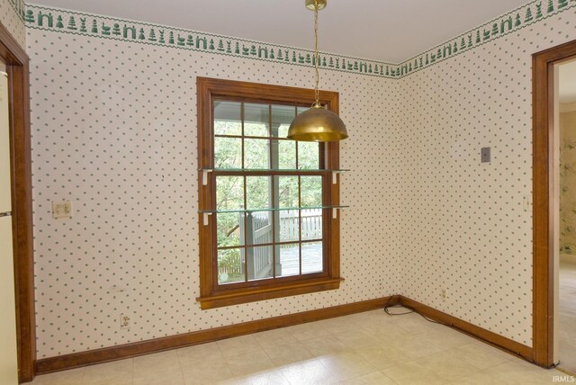 unfurnished dining area with light tile patterned floors