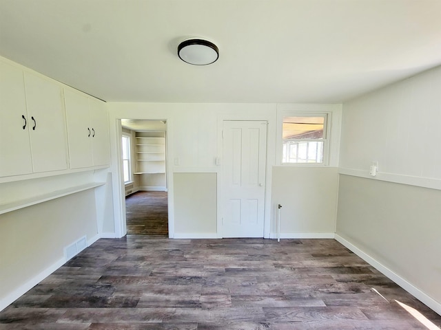 empty room featuring hardwood / wood-style flooring