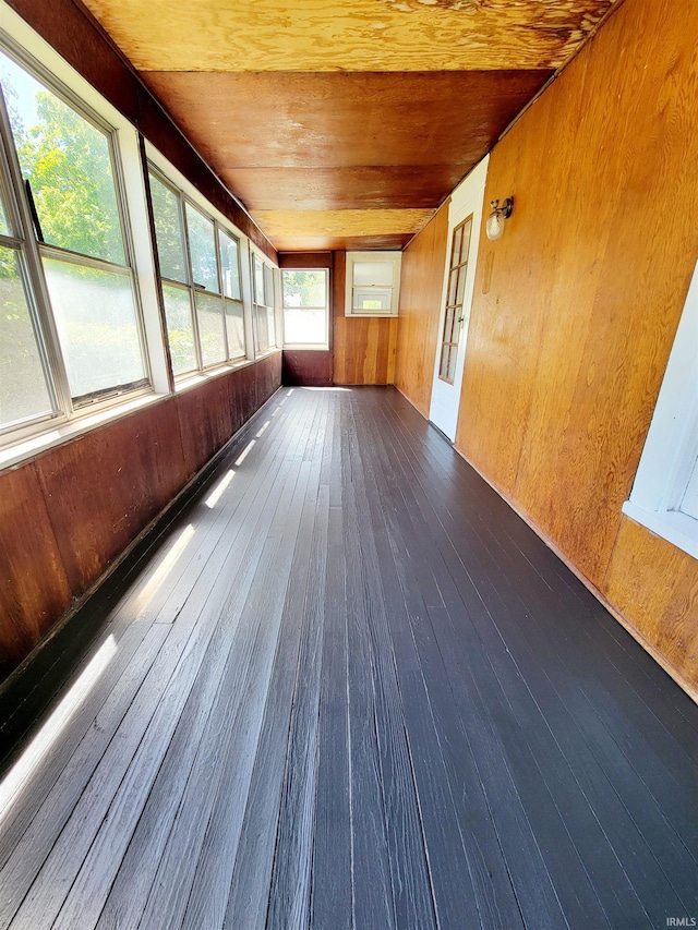 unfurnished sunroom featuring wooden ceiling