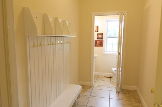 bathroom featuring tile patterned floors and toilet