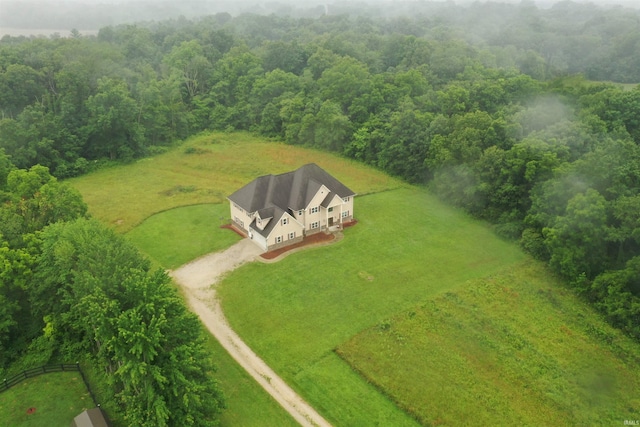 birds eye view of property with a rural view