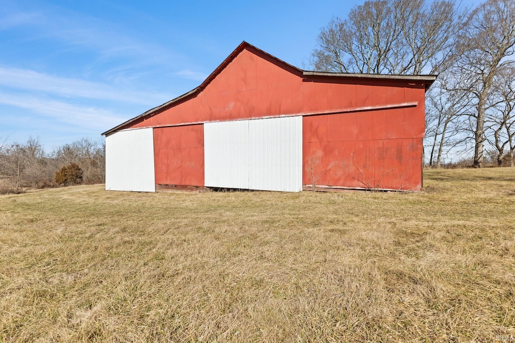 view of outdoor structure featuring a lawn