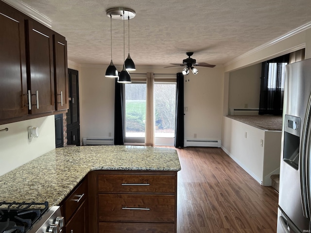 kitchen featuring light stone countertops, ceiling fan, stainless steel appliances, and a baseboard heating unit