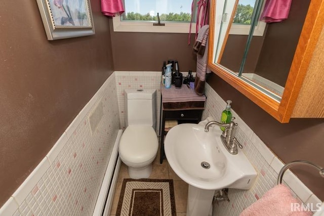 bathroom with sink, tile patterned flooring, and toilet