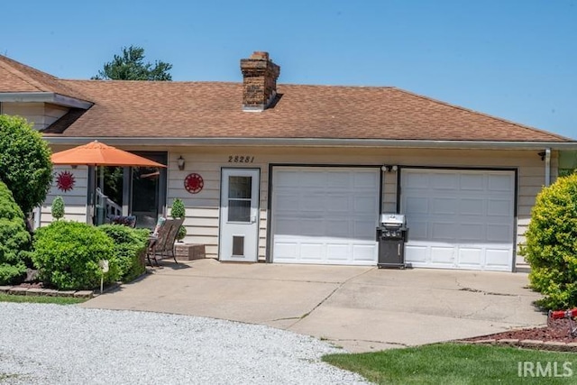 ranch-style house featuring a garage