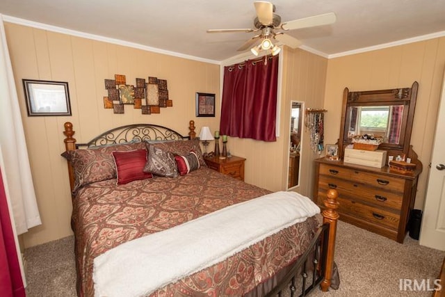 carpeted bedroom with ceiling fan and ornamental molding