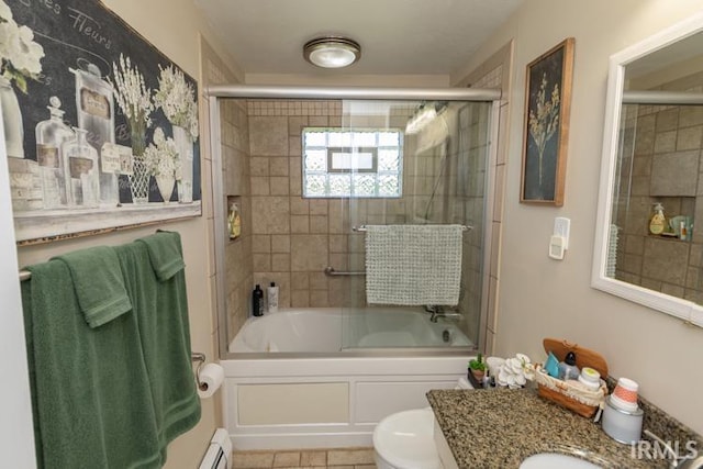 full bathroom featuring tile patterned floors, vanity, a baseboard radiator, enclosed tub / shower combo, and toilet