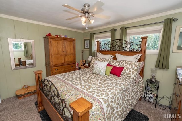 bedroom with carpet floors, crown molding, and ceiling fan