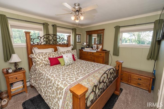 carpeted bedroom featuring ceiling fan and ornamental molding