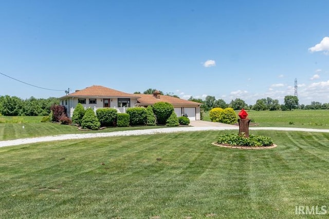 ranch-style house with a front yard and a garage