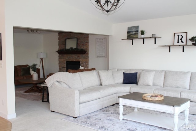 living room with light colored carpet and a fireplace