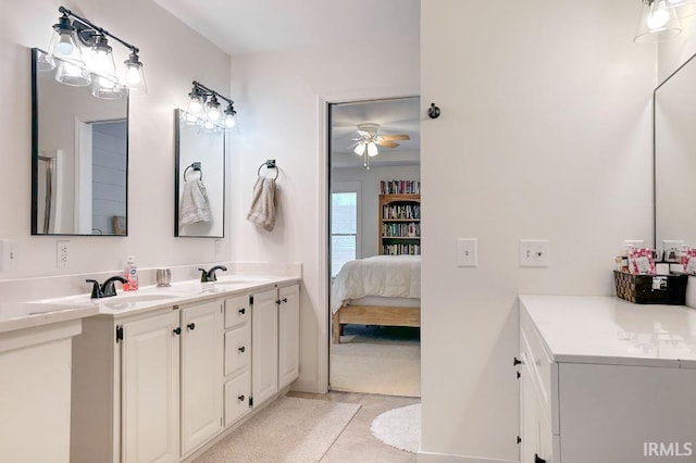 bathroom featuring a sink, double vanity, connected bathroom, and tile patterned floors