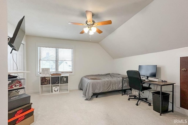 carpeted bedroom featuring vaulted ceiling, a ceiling fan, and baseboards