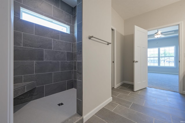 bathroom featuring tile patterned floors, ceiling fan, and tiled shower