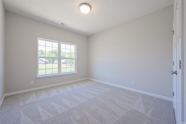 unfurnished room featuring carpet flooring