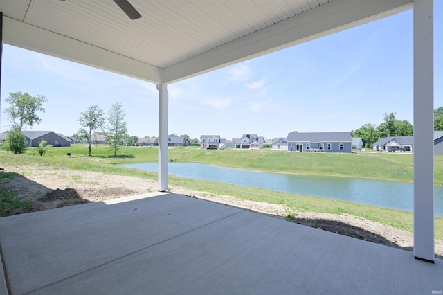 view of patio / terrace with a water view and ceiling fan