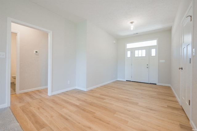 foyer with light hardwood / wood-style floors