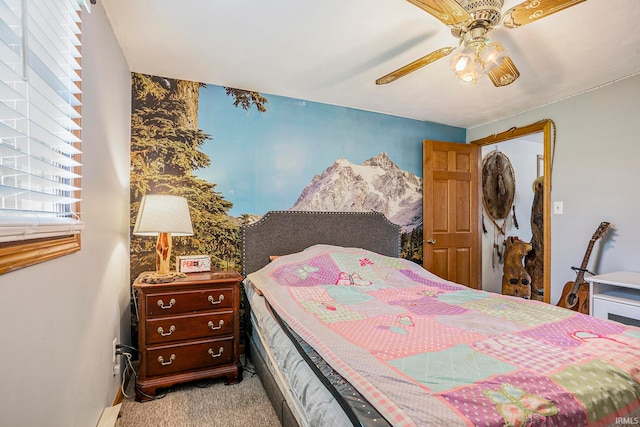 bedroom featuring ceiling fan and light carpet