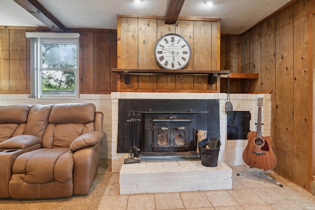 interior details with beamed ceiling, a textured ceiling, and wooden walls