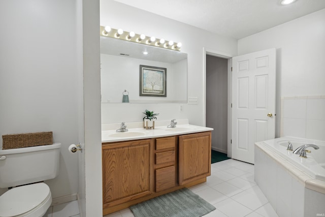 bathroom with vanity, tile patterned floors, tiled bath, and toilet