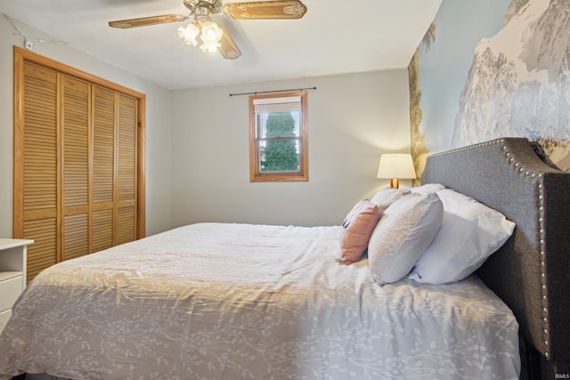 bedroom featuring ceiling fan and a closet