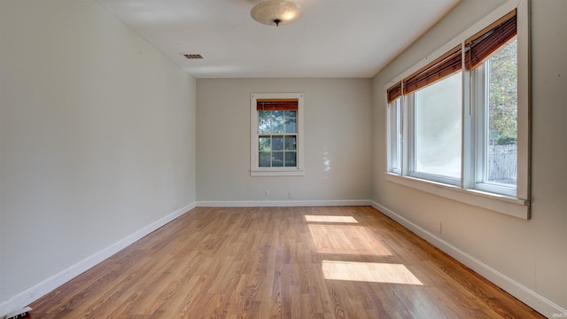 unfurnished room featuring light hardwood / wood-style floors