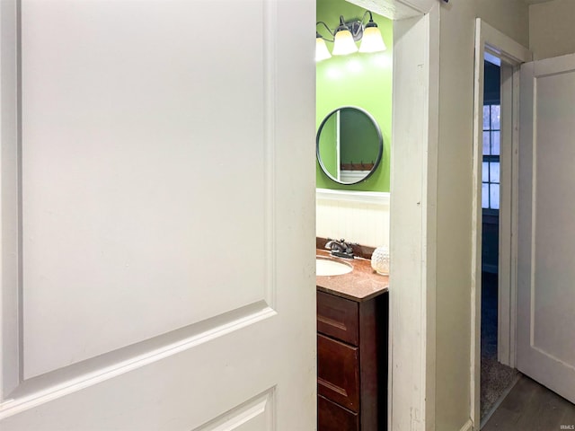 bathroom featuring wood-type flooring and vanity