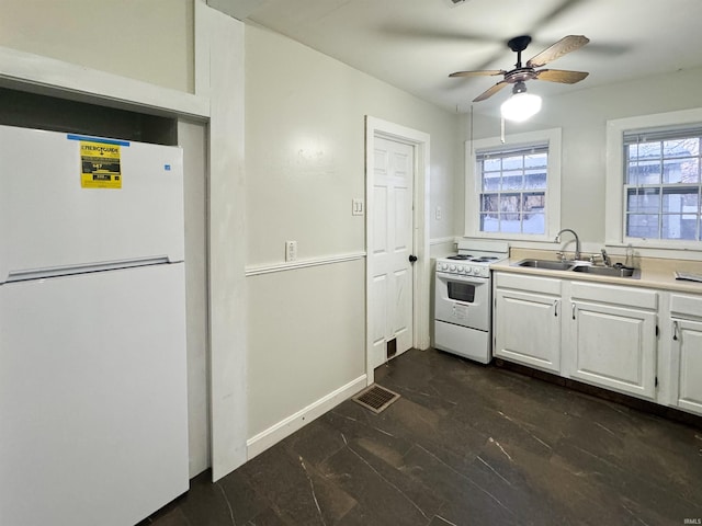 kitchen with white cabinetry, sink, white appliances, and ceiling fan