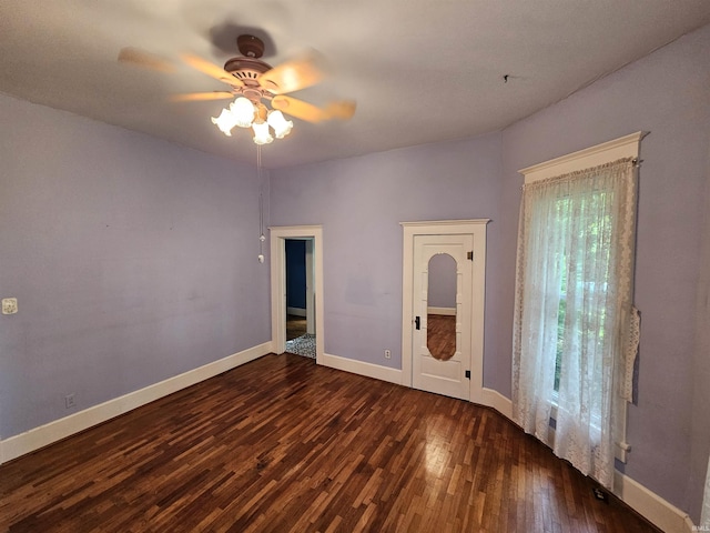 unfurnished bedroom with dark hardwood / wood-style flooring and ceiling fan