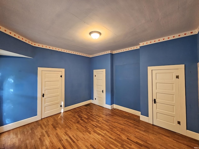 unfurnished room featuring hardwood / wood-style floors