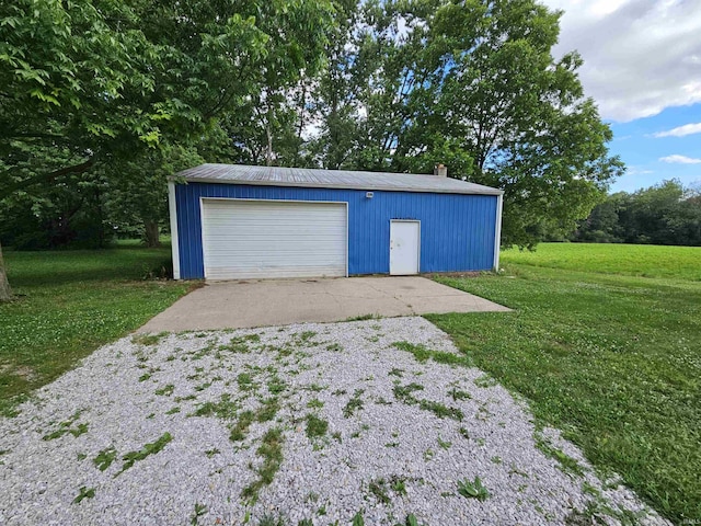 garage with a lawn